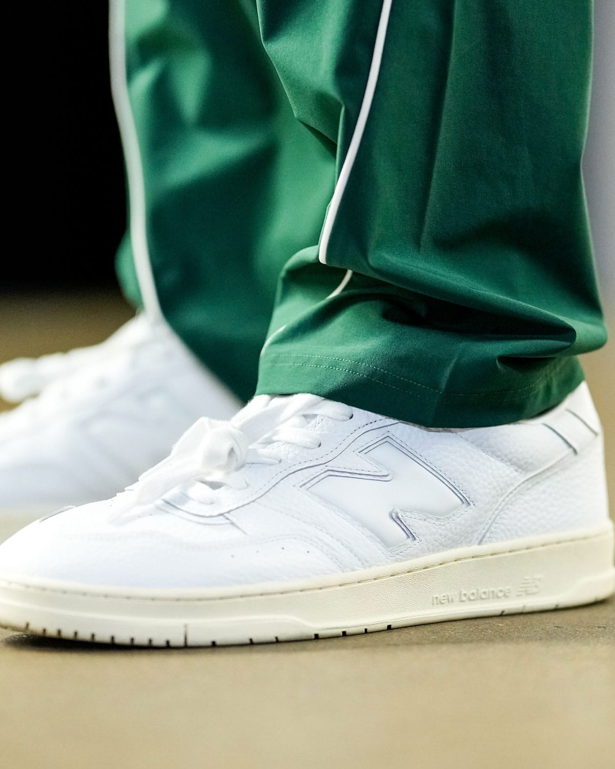 New Balance 950 detail showing the puffed N logo and suede paneling