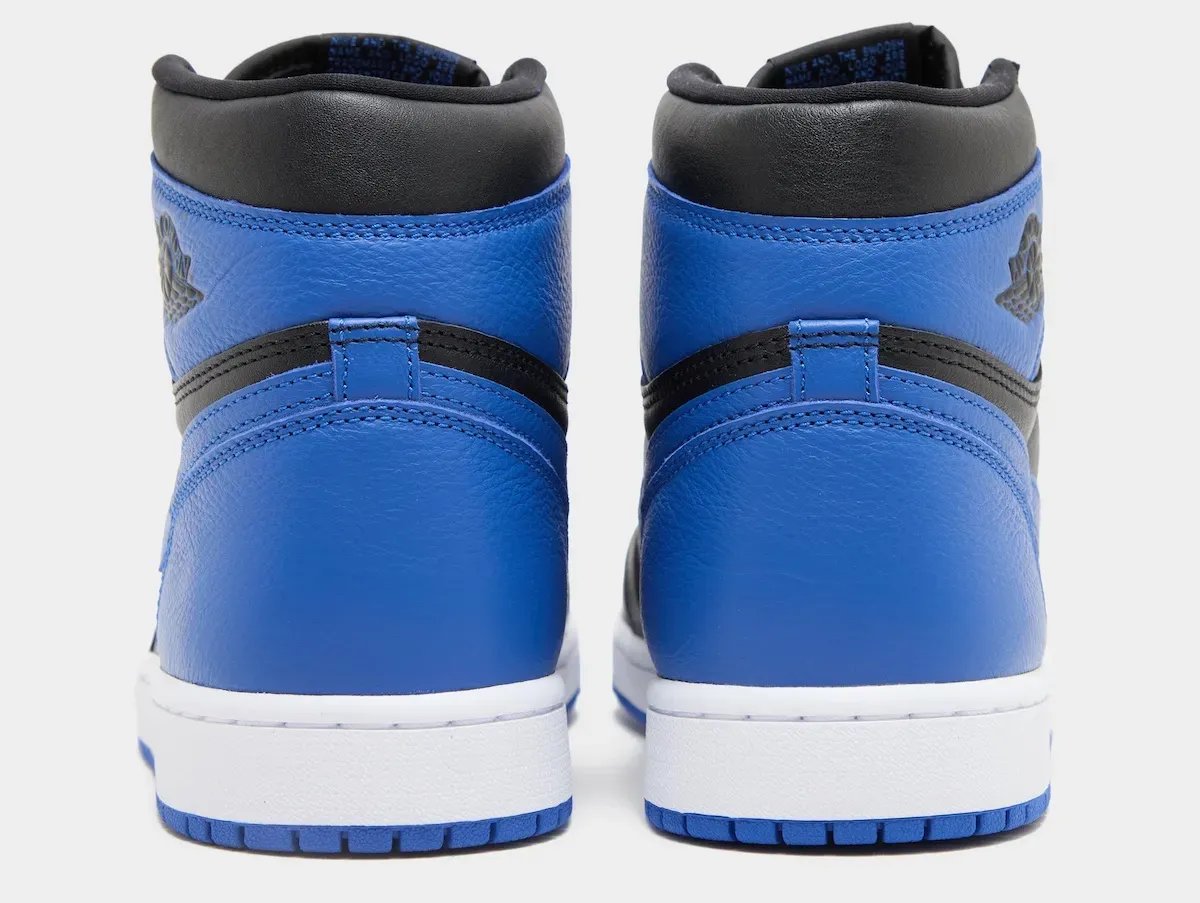 Heel view of the Air Jordan 1 Retro High OG Royal 2026 showing the debossed Wings logo on Varsity Royal leather