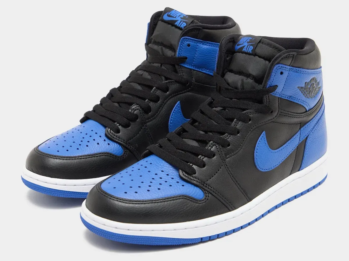 Three-quarter front view of the Air Jordan 1 Retro High OG Royal 2026 pair showing the perforated Varsity Royal toe box