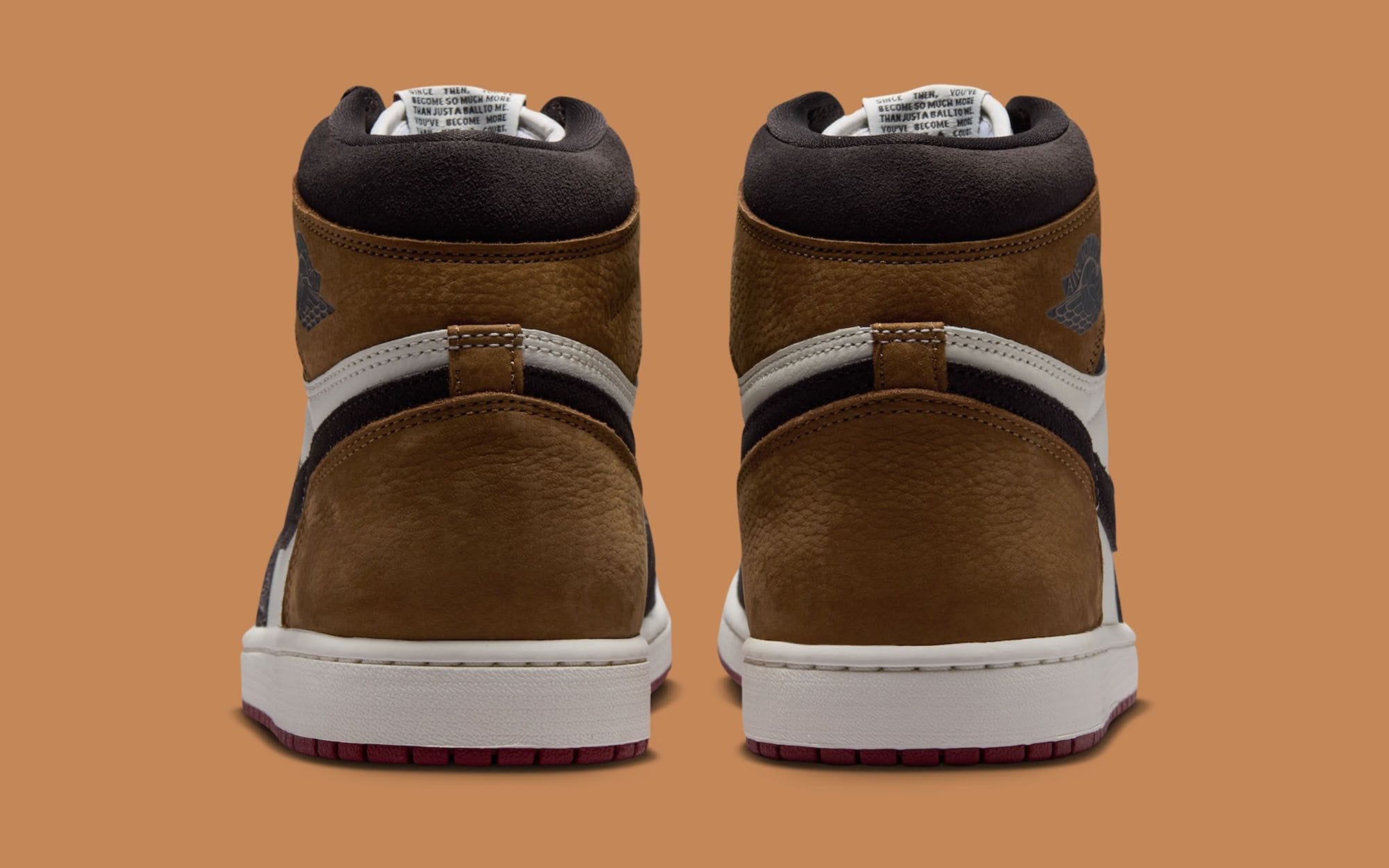 Air Jordan 1 High OG Love Letter heel view showing the inner tongue tag printed with a line from Michael Jordan's retirement letter