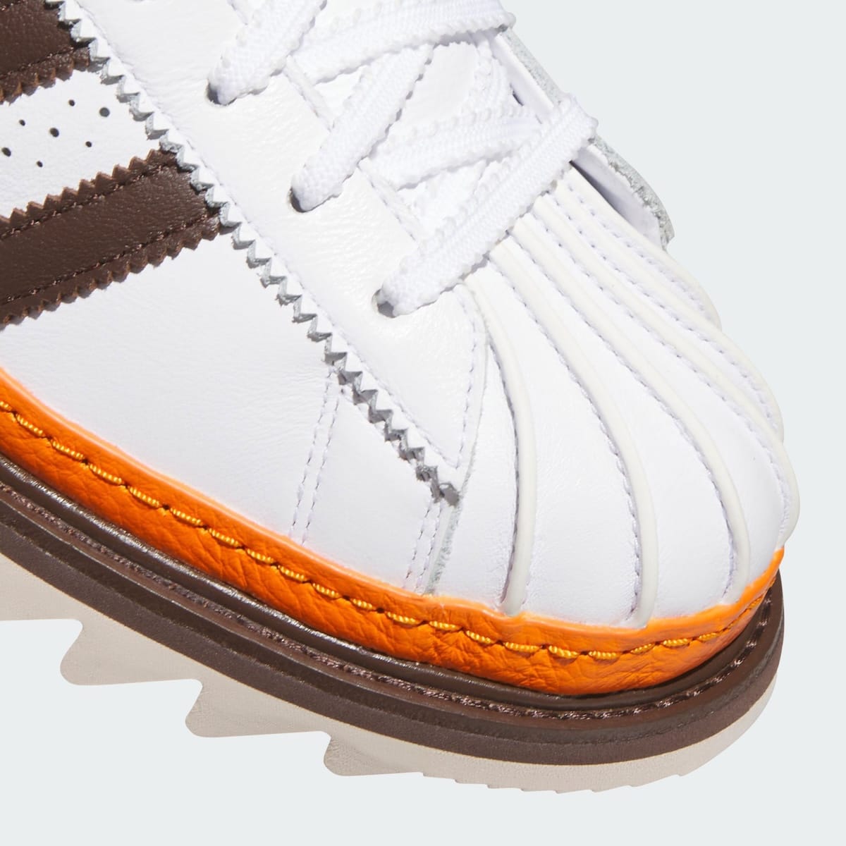 CLOT x adidas Superstar Unity Orange macro detail of orange leather welt stitching