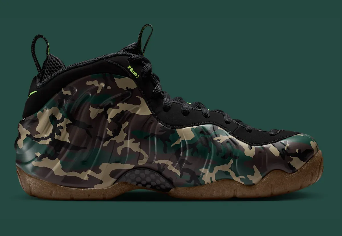 Lateral view of the Nike Air Foamposite Pro Green Camo IM5204-001 showing the woodland camo shell and gum outsole