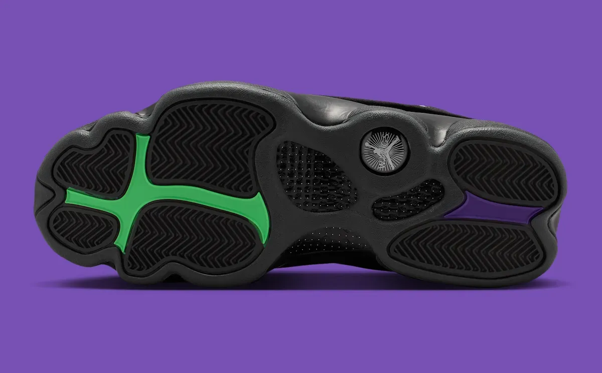 Air Jordan 13 Wings outsole showing mismatched green and purple traction pods and the Jumpman medallion