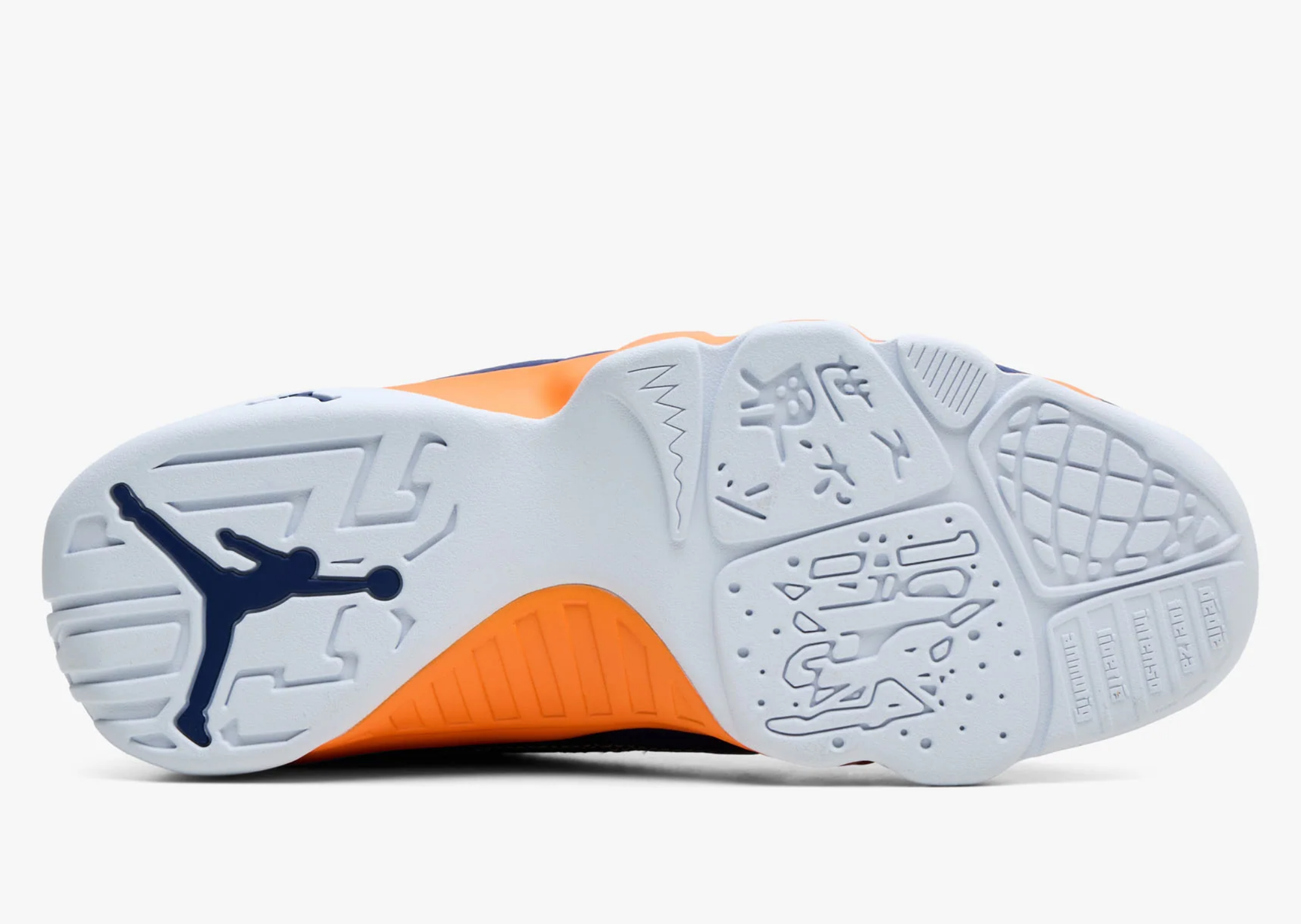 Outsole of the Air Jordan 9 Low What The Kilroy with orange and white tooling and a navy Jumpman