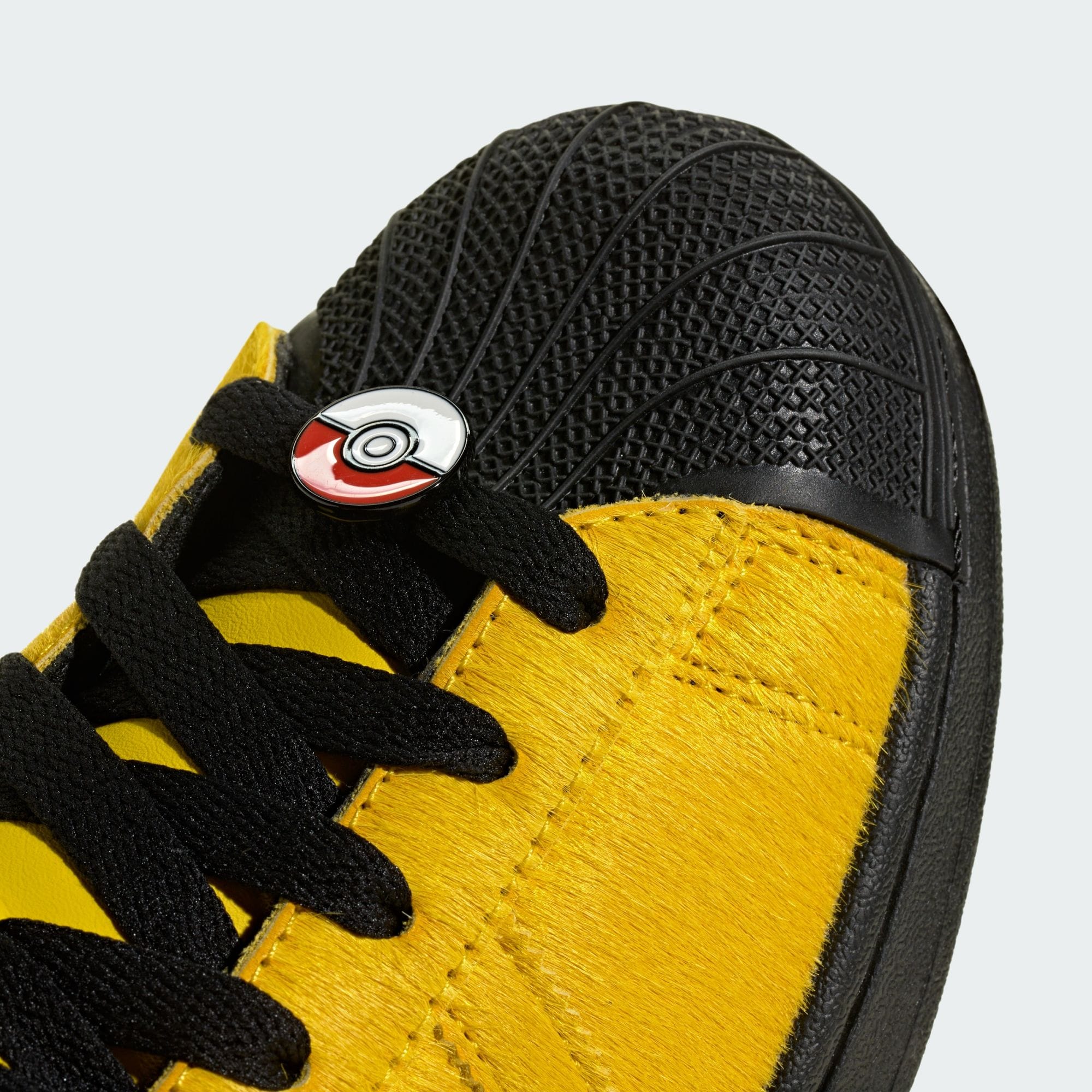 Pokémon x adidas Pro Model Pikachu in yellow pony hair with a Pikachu charm near the heel