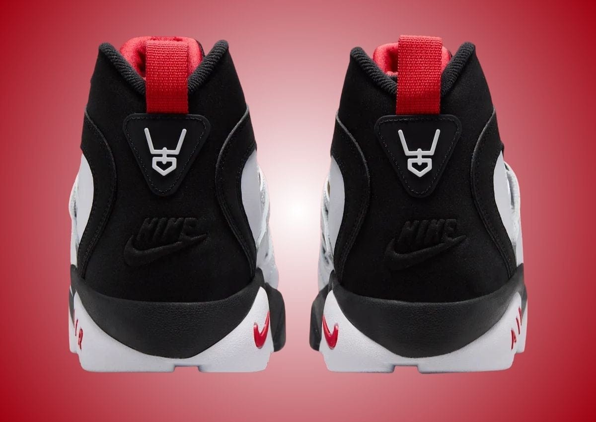 Heel view of the Nike Air Diamond Turf 2 "49ers" showing Deion Sanders' signature logo on the heel tab