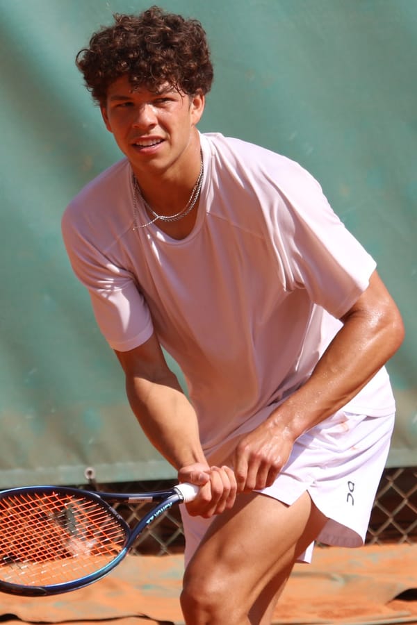 American tennis player Ben Shelton in a ready position with his racket.