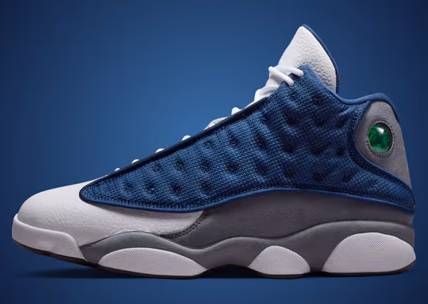 Air Jordan 13 "Flint" 2026 lateral view showing navy mesh, Flint Grey suede and white leather