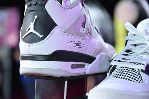 Close-up of a hand-signed Air Jordan 4 heel from Eminem's sneaker collection auction