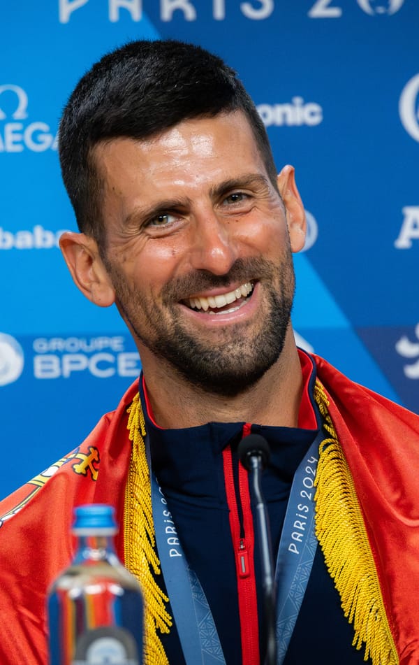 Novak Djokovic in action on a tennis court