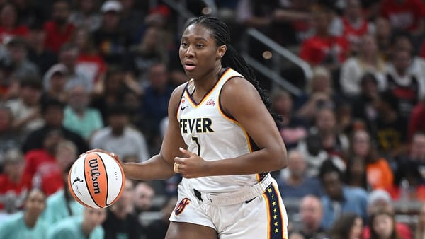 Indiana Fever and New York Liberty players compete during a WNBA game