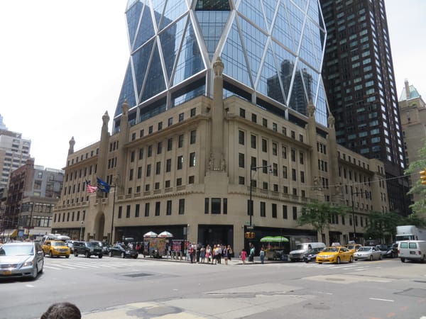 Hearst Tower in Manhattan, the glass diagrid tower rising from its 1928 Art Deco stone base