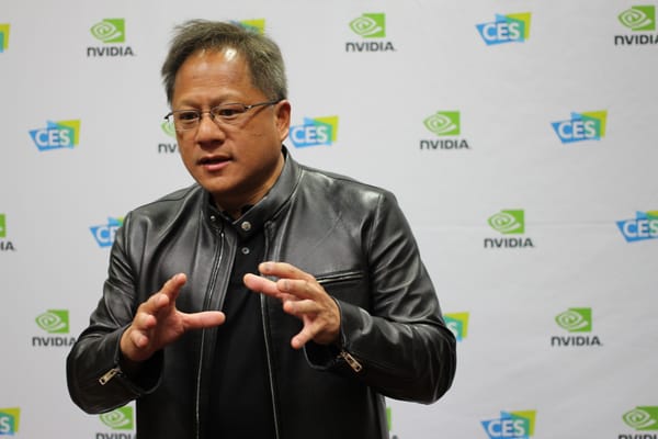 Nvidia chief executive Jensen Huang speaking in front of an NVIDIA and CES backdrop