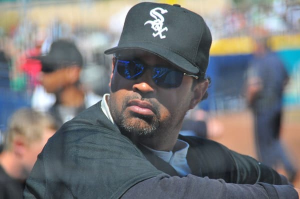 Ozzie Guillén in a Chicago White Sox cap and sunglasses on the field before a game