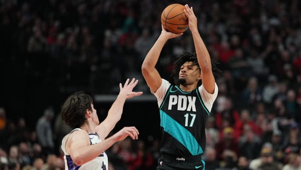 Portland Trail Blazers guard Shaedon Sharpe shooting a jump shot in a black and teal PDX jersey