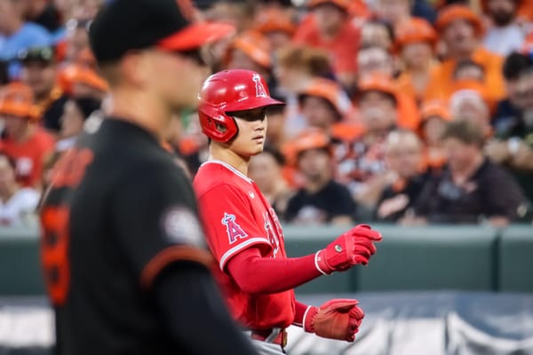 Shohei Ohtani in uniform at bat, whose game-worn New Balance Ohtani 1 cleats sold for a record $440,055 at auction